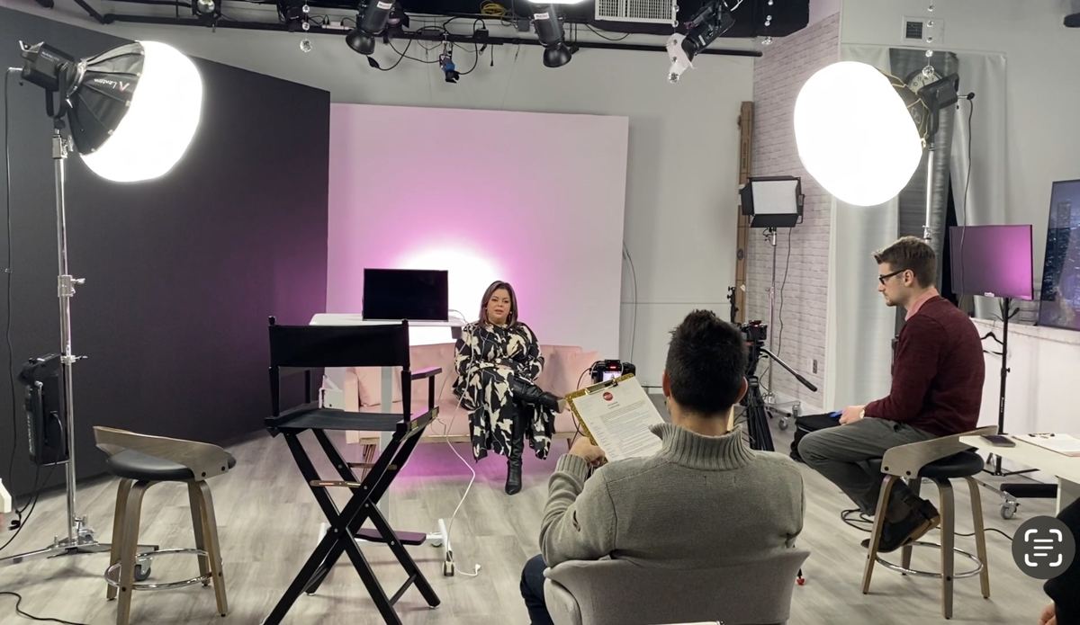 Interview set with director's chair, softboxes and crew